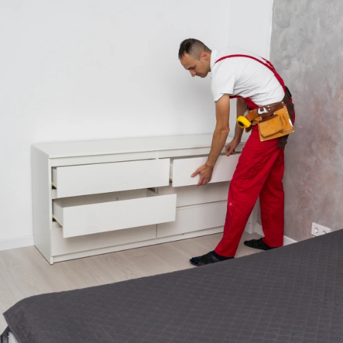 Expert movers handling beds wardrobes dressers and bedroom furniture relocation
