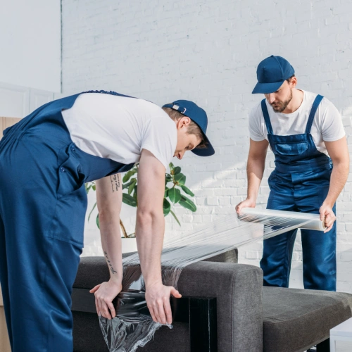 Skilled villa movers handling sofas beds tables and household furniture in JLT