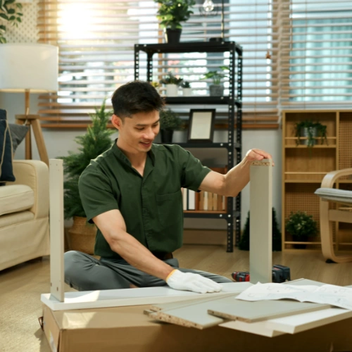 Skilled movers disassembling and reassembling villa furniture during relocation in Dubai
