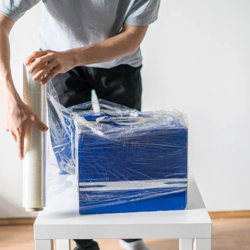 Expert movers packing luxury furniture and valuable household items for safe relocation