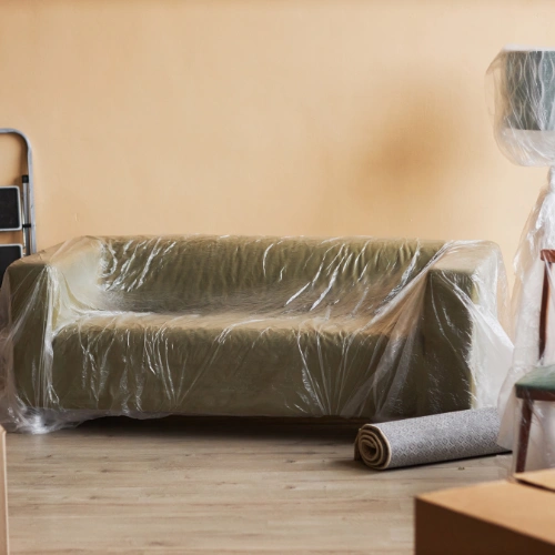 Protective wrapping and secure handling of furnished villa furniture during transportation